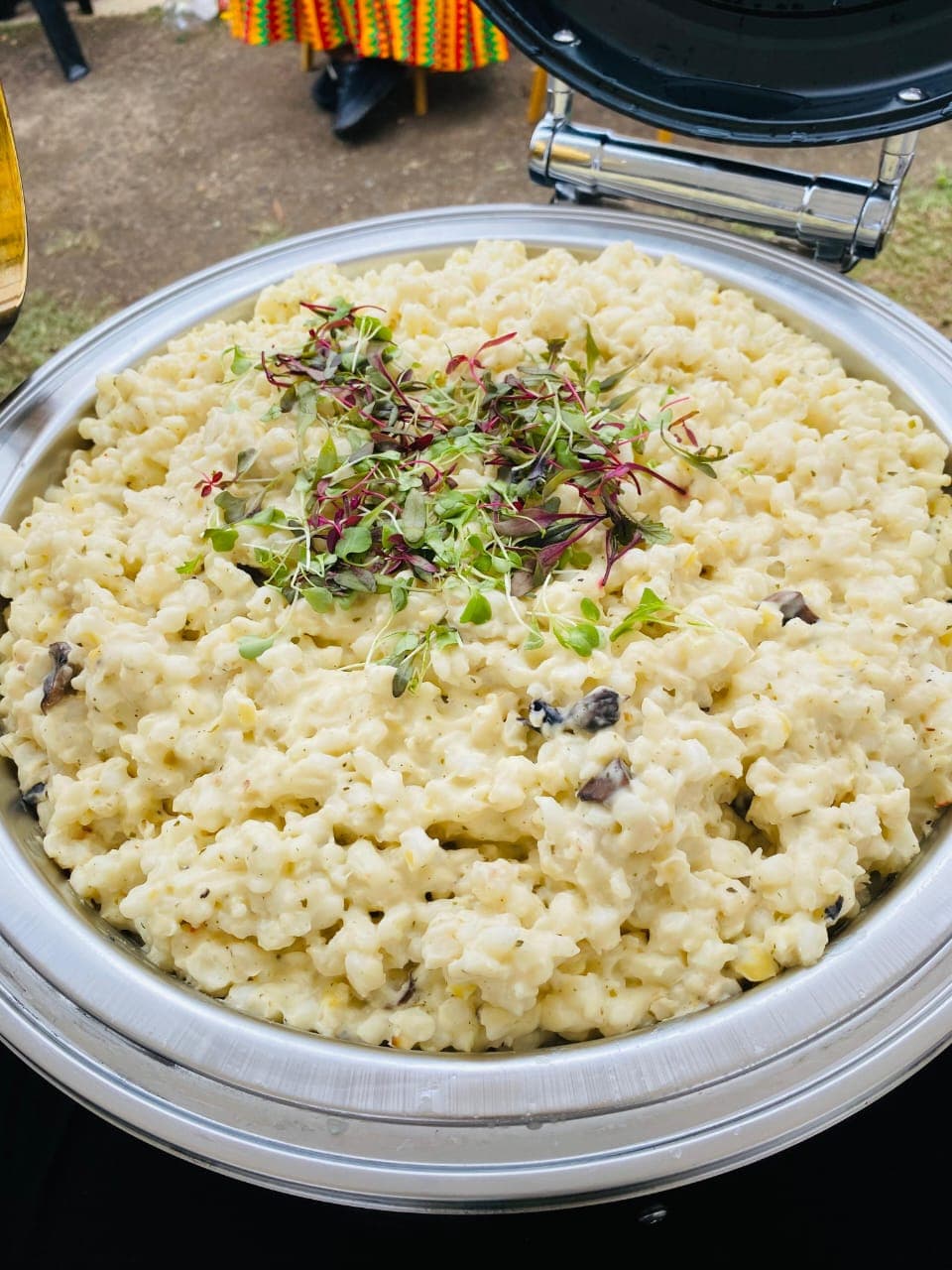 Creamy samp and beans dish garnished with microgreens